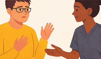 Två personer sitter och samtalar