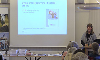 Bild på Merike Hansson som föreläser